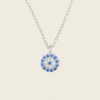 Blue Halo Necklace with a round pendant with blue and clear stone accents in silver finish