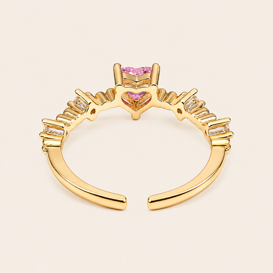 Blush Heart Ring with a pink heart-shaped stone and clear shoulder accents in gold finish
