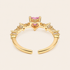 Blush Heart Ring with a pink heart-shaped stone and clear shoulder accents in gold finish