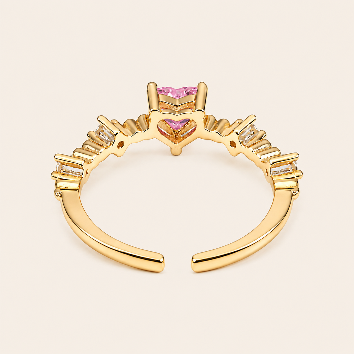 Blush Heart Ring with a pink heart-shaped stone and clear shoulder accents in gold finish