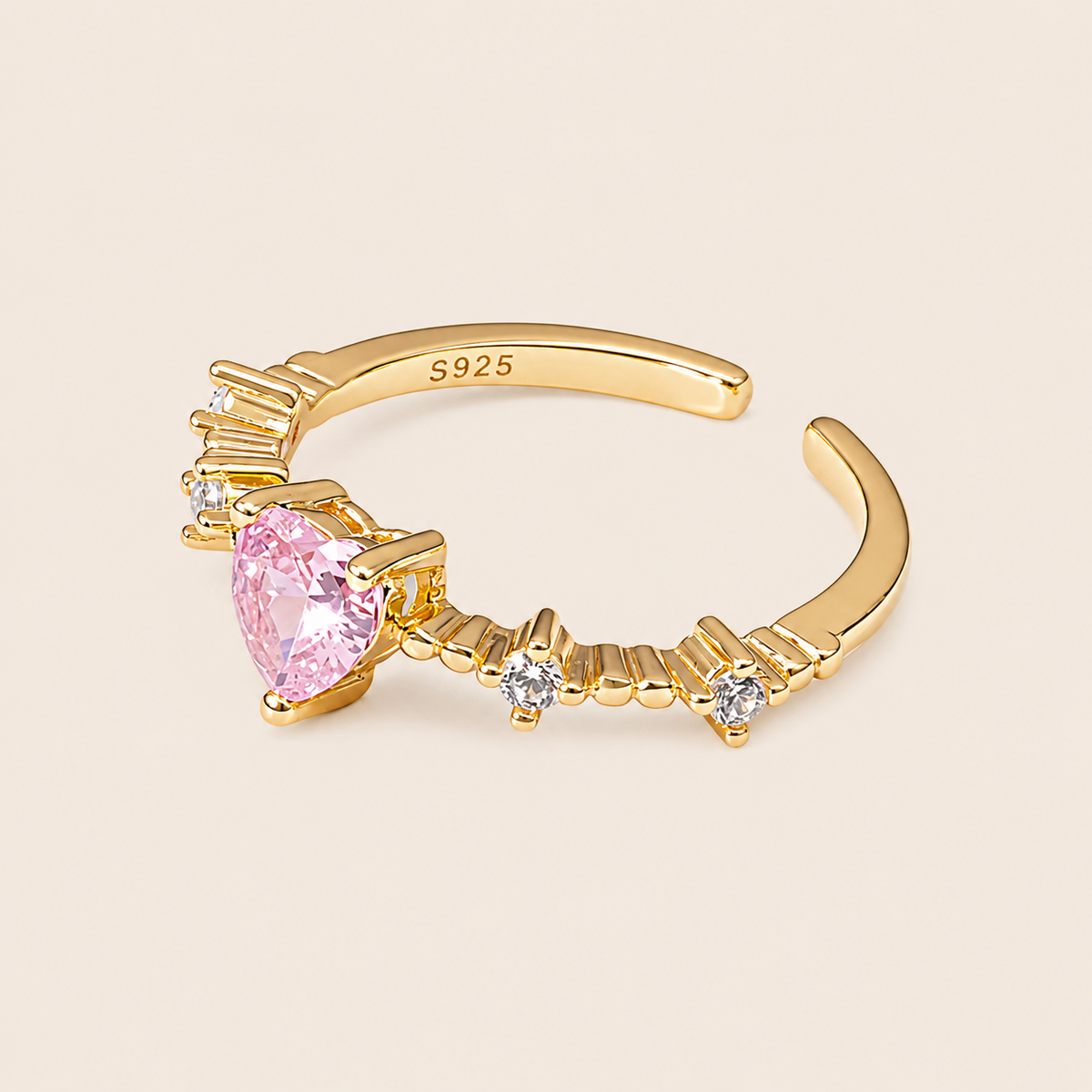 Blush Heart Ring with a pink heart-shaped stone and clear shoulder accents in gold finish