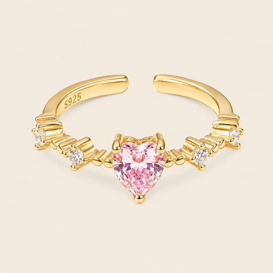 Blush Heart Ring with a pink heart-shaped stone and clear shoulder accents in gold finish