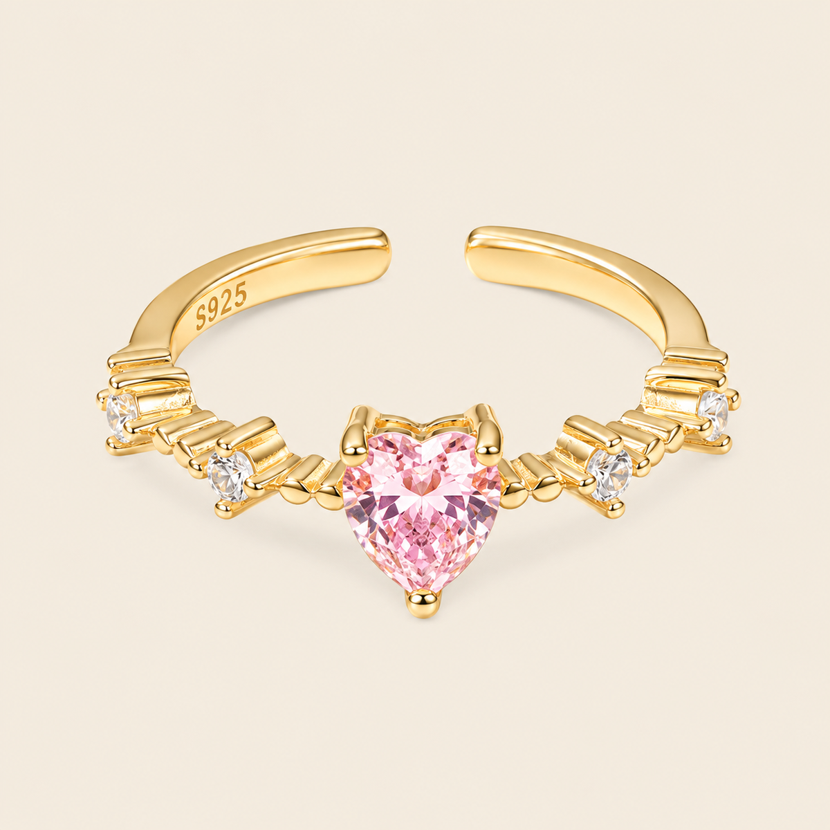 Blush Heart Ring with a pink heart-shaped stone and clear shoulder accents in gold finish