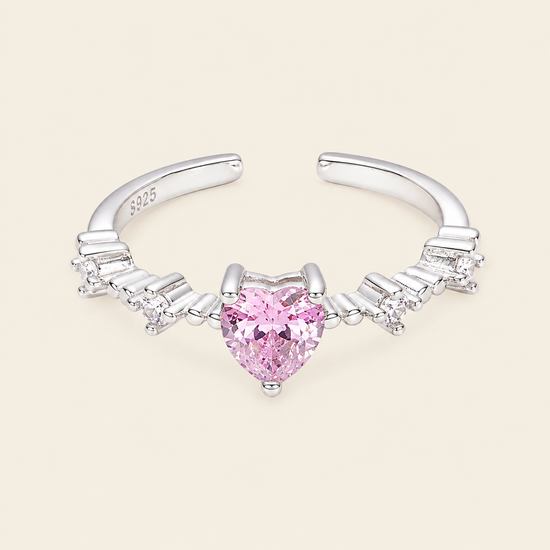 Blush Heart Ring with a pink heart-shaped stone and clear shoulder accents in silver finish