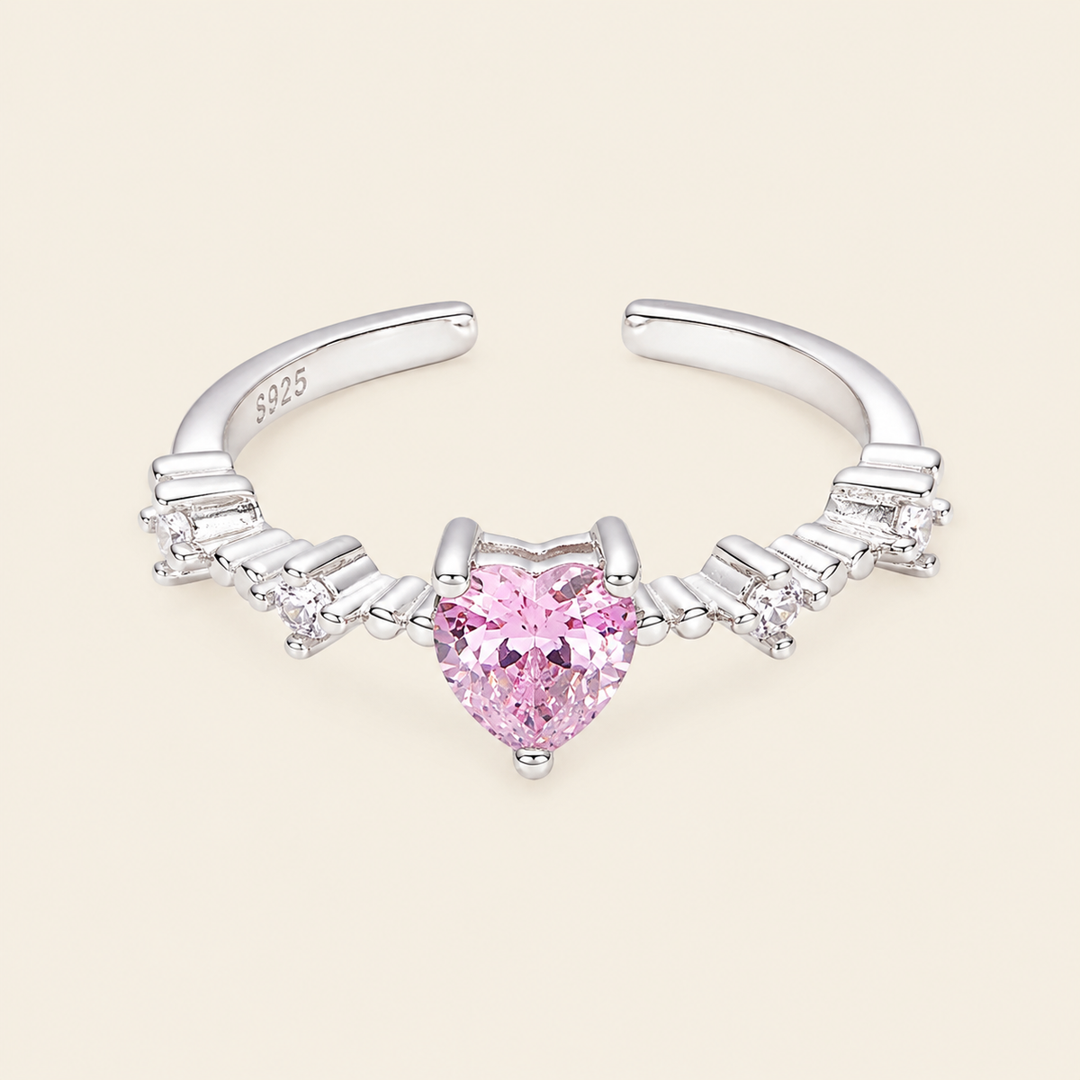 Blush Heart Ring with a pink heart-shaped stone and clear shoulder accents in silver finish