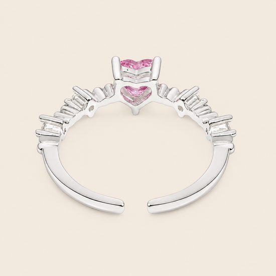 Blush Heart Ring with a pink heart-shaped stone and clear shoulder accents in silver finish