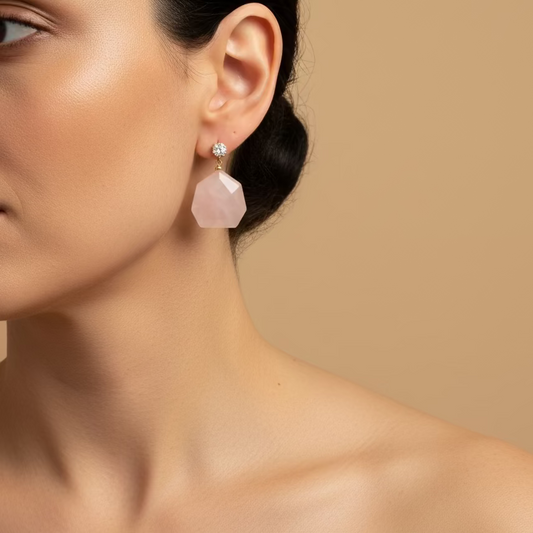 Blush Hex Earrings worn on the ear, with pale pink hexagonal stone drops