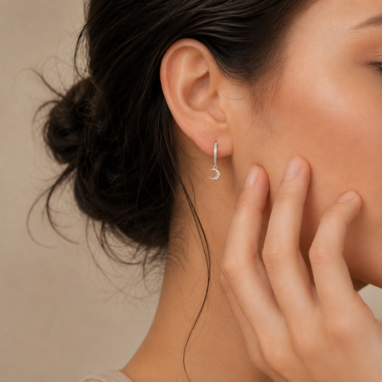 Celestial Light Earrings worn on the ear in gold finish