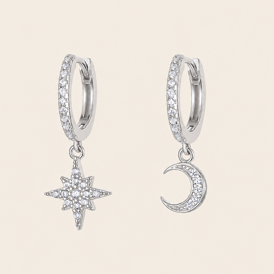 Celestial Light Earrings with crescent moon and star charms on small hoops in silver finish