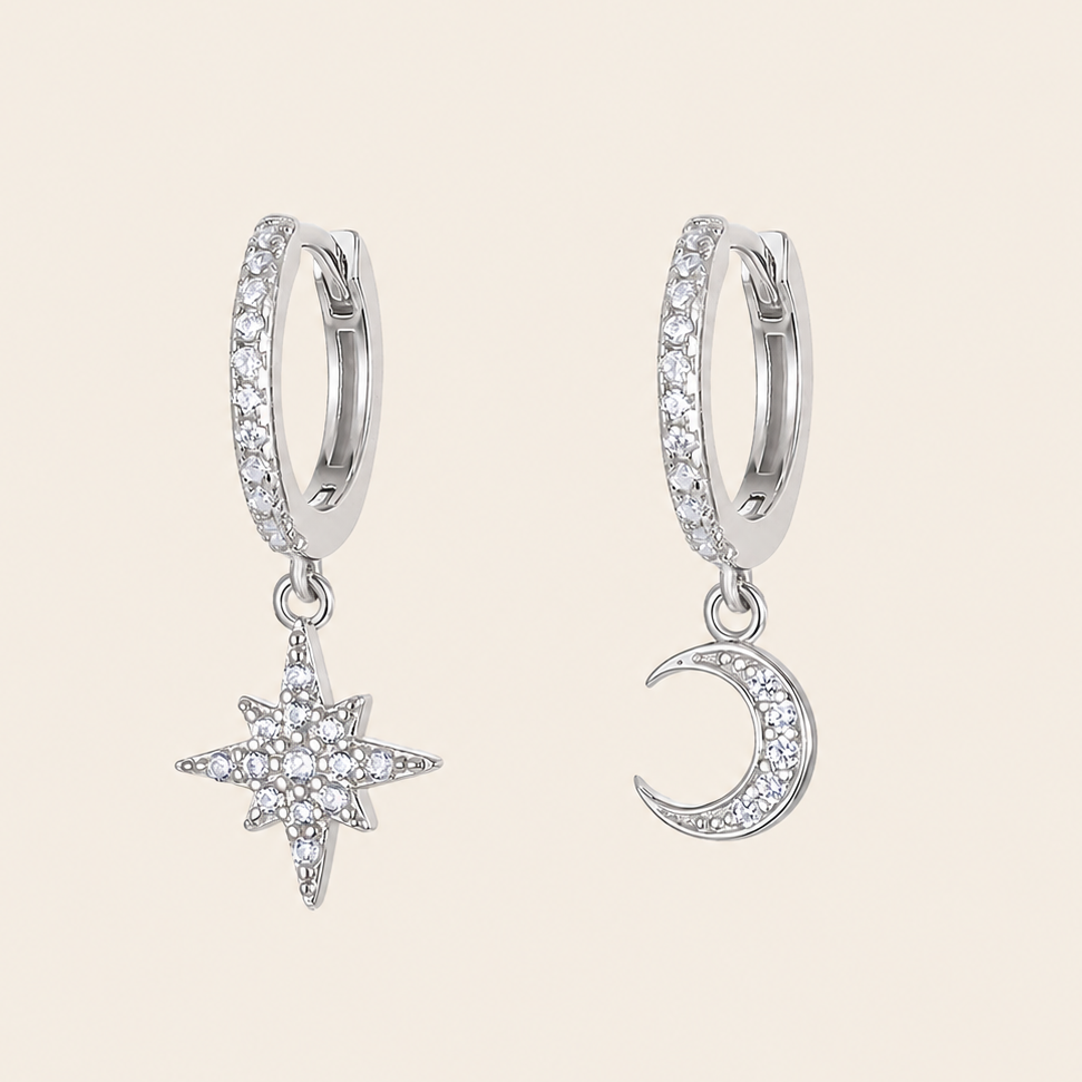 Celestial Light Earrings with crescent moon and star charms on small hoops in silver finish