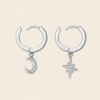 Celestial Light Earrings with crescent moon and star charms on small hoops in silver finish