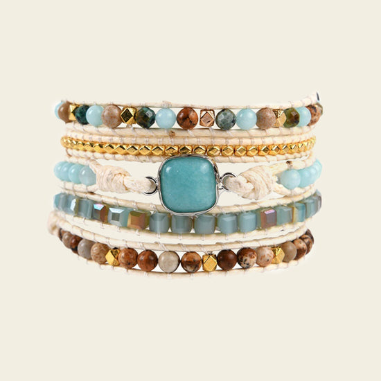 Clear Interval Bracelet with layered pale and brown beads with a turquoise-coloured centre