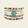 Clear Interval Bracelet with layered pale and brown beads with a turquoise-coloured centre