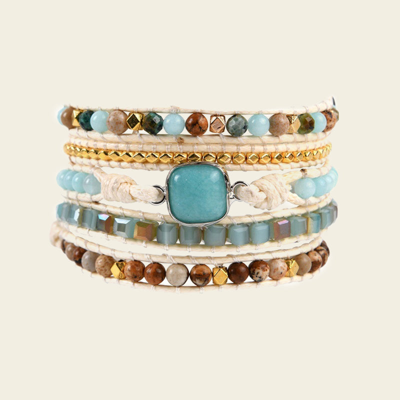 Clear Interval Bracelet with layered pale and brown beads with a turquoise-coloured centre