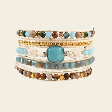 Clear Interval Bracelet with layered pale and brown beads with a turquoise-coloured centre