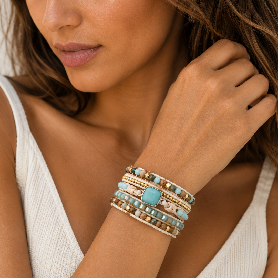 Clear Interval Bracelet worn on the wrist, with layered pale and brown beads with a turquoise-coloured centre