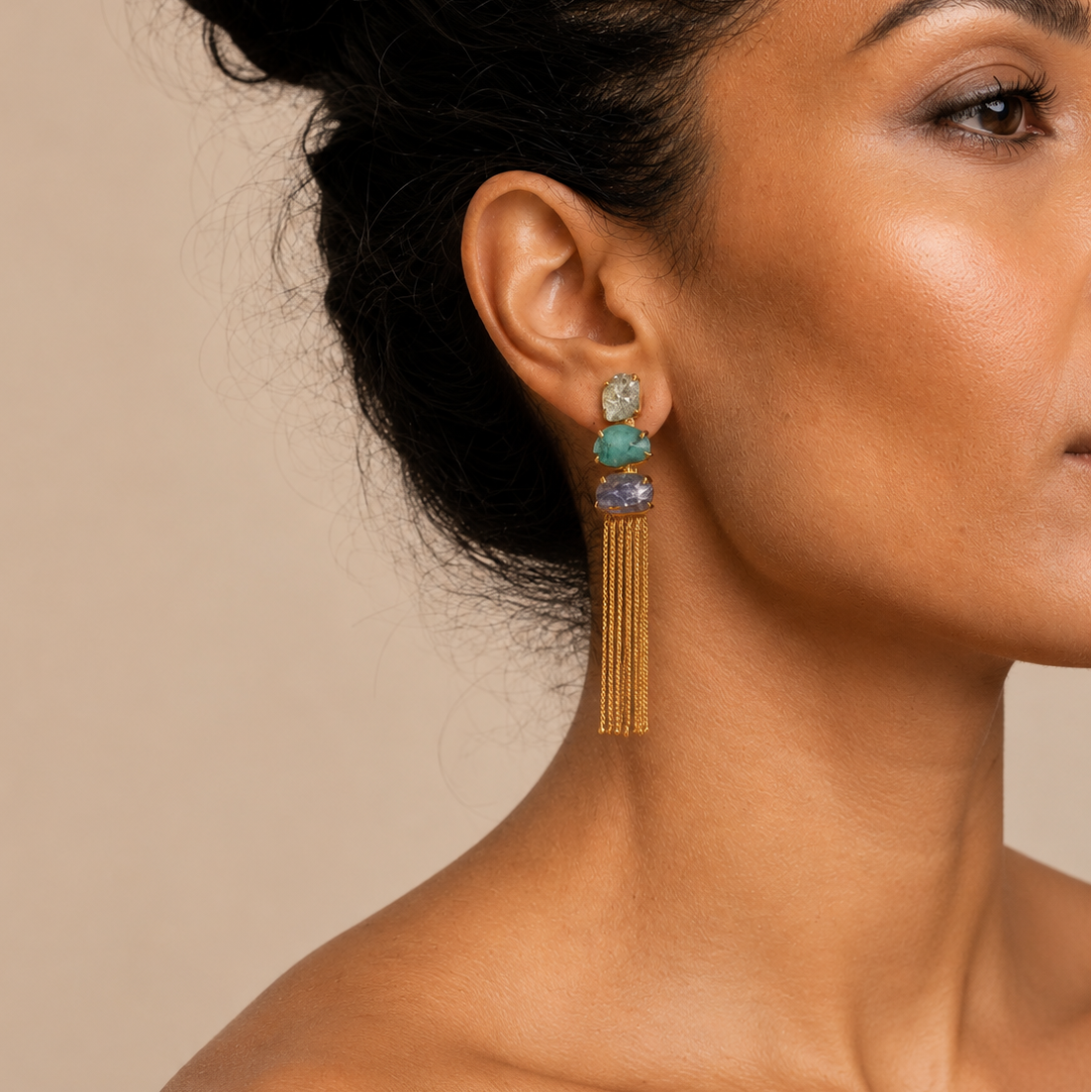 Coastal Drift Earrings worn on the ear, with long chain tassels below blue and green stone accents
