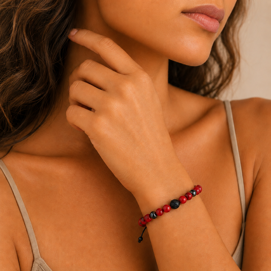 Core Balance Bracelet worn on the wrist, with round stone beads and a dark centre bead