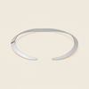 Crescent Collar Necklace with a smooth curved collar band in silver finish