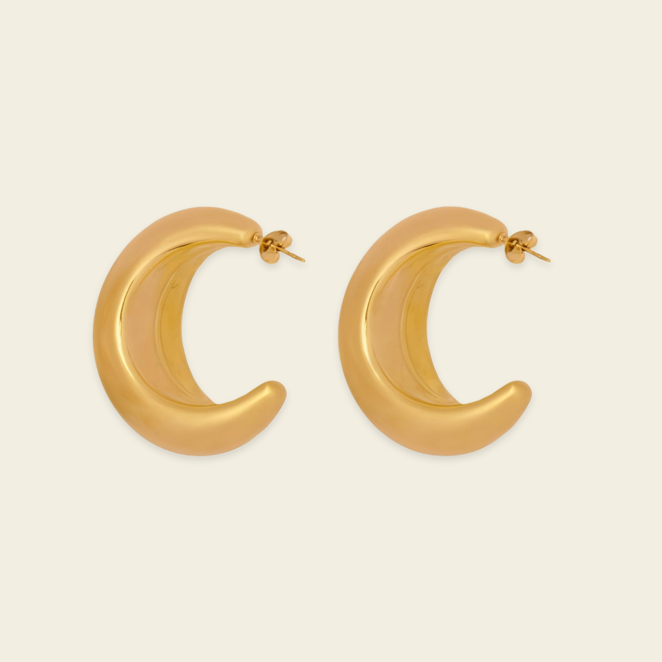 Crescent Sweep Earrings with broad polished crescent-shaped hoops in gold finish