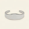 Crest Band Cuff with a broad polished band with a wavy edge in silver finish