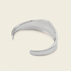 Crest Band Cuff with a broad polished band with a wavy edge in silver finish
