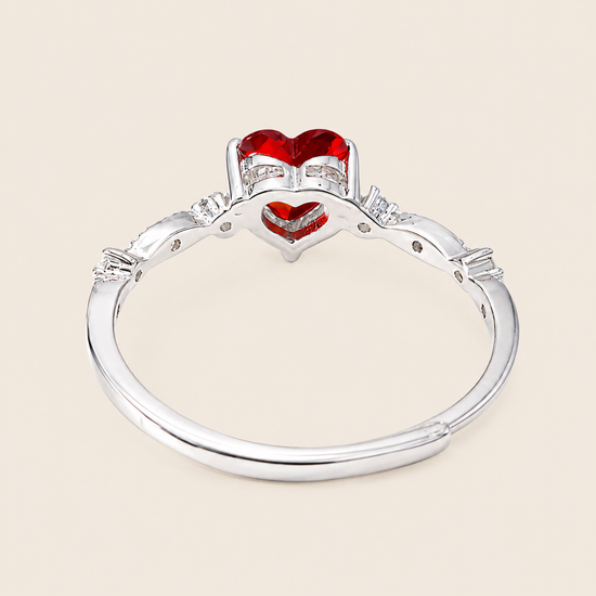 Crimson Heart Ring with a red heart-shaped stone and clear accents in silver finish