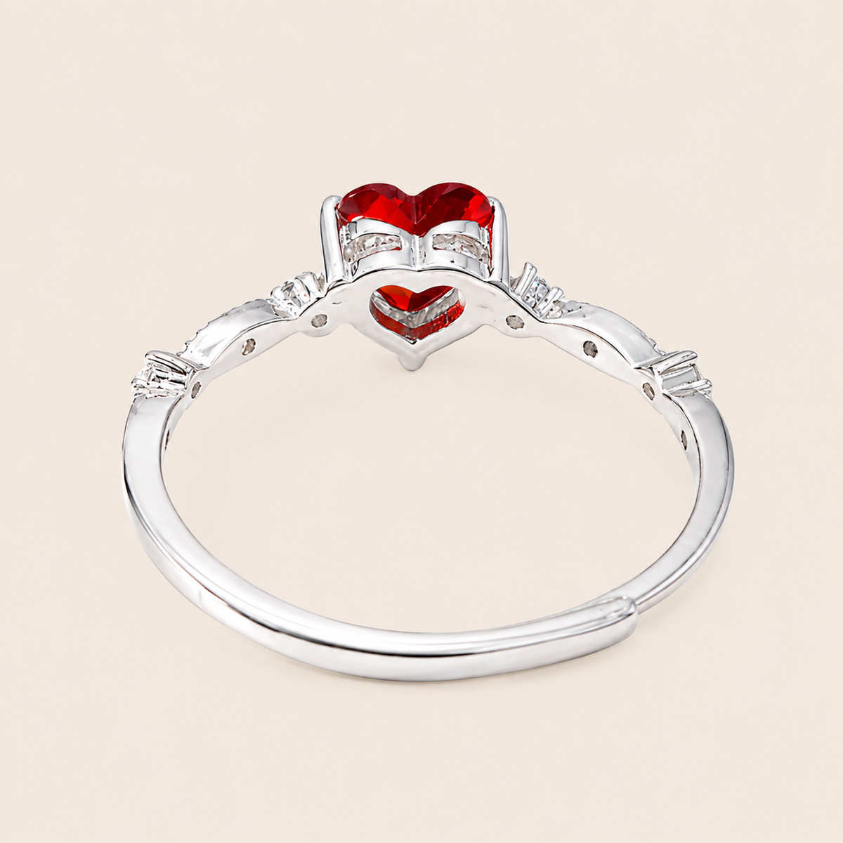 Crimson Heart Ring with a red heart-shaped stone and clear accents in silver finish