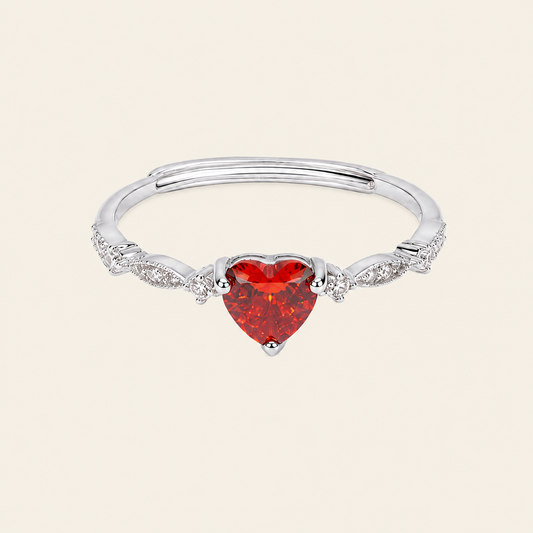 Crimson Heart Ring with a red heart-shaped stone and clear accents in silver finish