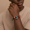 Crimson Line Bracelet worn on the wrist, with a beaded strand paired with a woven cord band