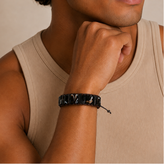 Darkline Tile Bracelet worn on the wrist, with dark polished stone tiles with pale streaks