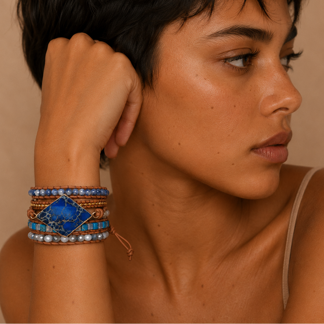 Deep Mark Bracelet worn on the wrist, with layered blue and earth-toned stone beads