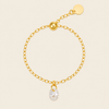 Dewdrop Chain Ring with an adjustable chain band and clear teardrop charm in gold finish