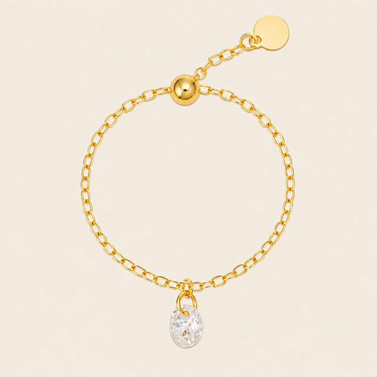 Dewdrop Chain Ring with an adjustable chain band and clear teardrop charm in gold finish