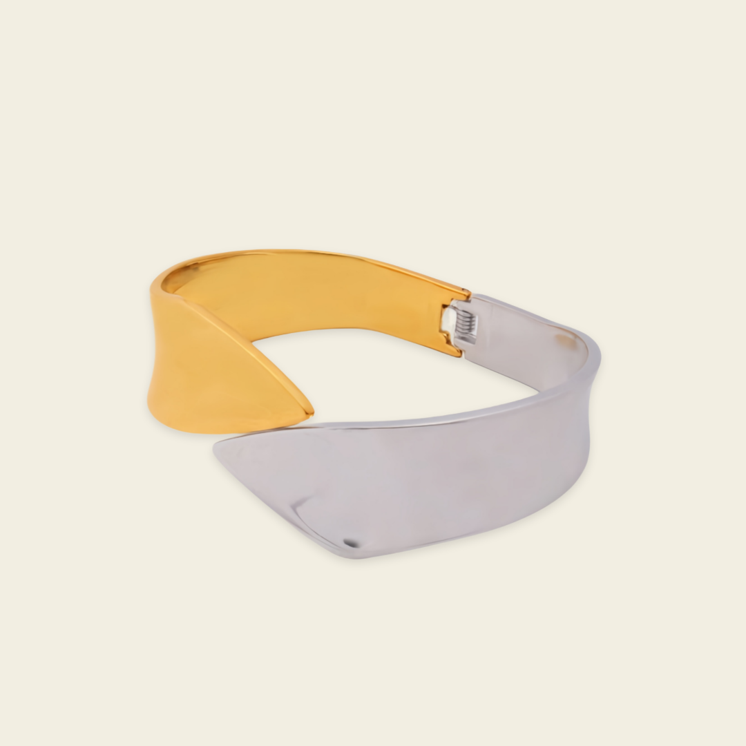 Dual Sweep Cuff with a broad two-tone curved band in gold and silver finish