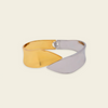 Dual Sweep Cuff with a broad two-tone curved band in gold and silver finish