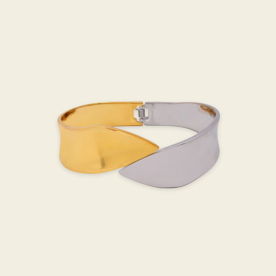 Dual Sweep Cuff with a broad two-tone curved band in gold and silver finish