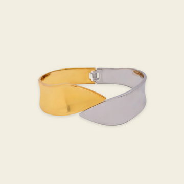 Dual Sweep Cuff with a broad two-tone curved band in gold and silver finish