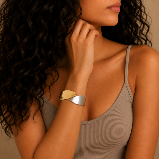 Dual Sweep Cuff worn on the wrist in gold and silver finish