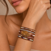 Earth Pattern Bracelet worn on the wrist, with layered cream and earth-toned beads