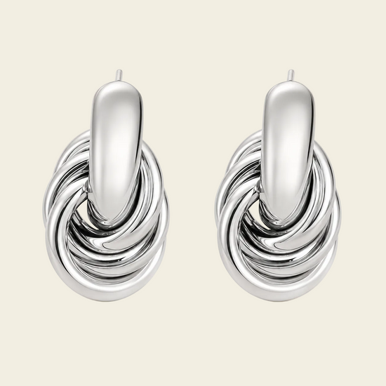 Echo Loop Earrings with interlocking sculptural loop drops in silver finish