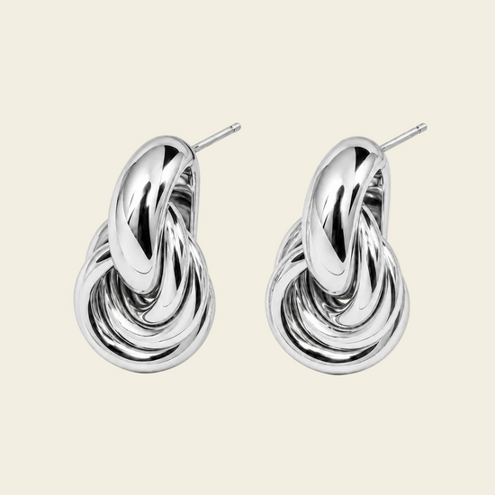 Echo Loop Earrings with interlocking sculptural loop drops in silver finish