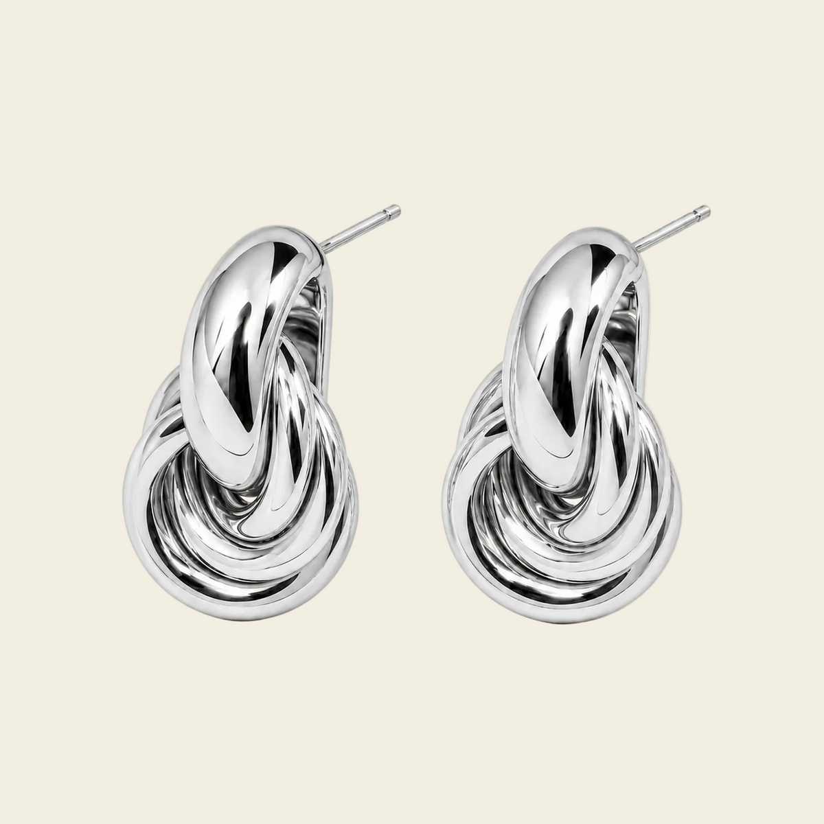 Echo Loop Earrings with interlocking sculptural loop drops in silver finish