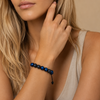 Ember Drift Bracelet worn on the wrist, with round stone beads on an adjustable cord