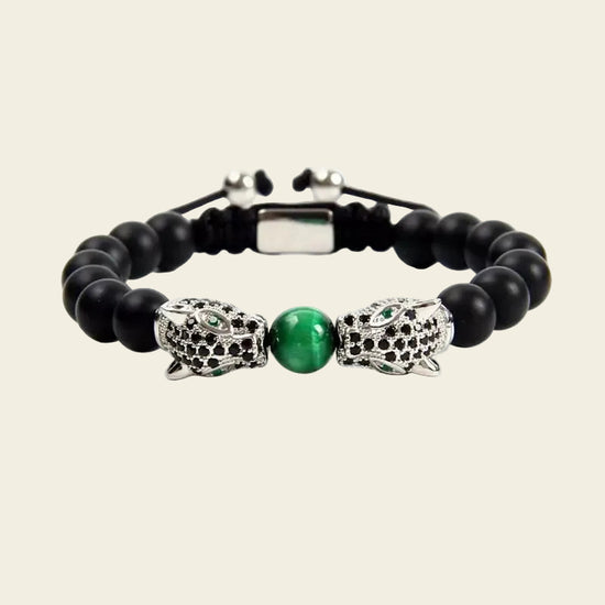 Emerald Leopard Bracelet with dark beads, a green centre bead and gold-coloured leopard accents