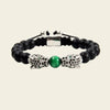 Emerald Leopard Bracelet with dark beads, a green centre bead and gold-coloured leopard accents