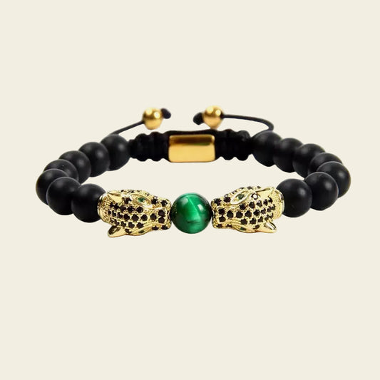 Emerald Leopard Bracelet with dark beads, a green centre bead and gold-coloured leopard accents