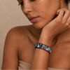 Fieldmark Tile Bracelet worn on the wrist, with multicoloured stone tiles and round beads