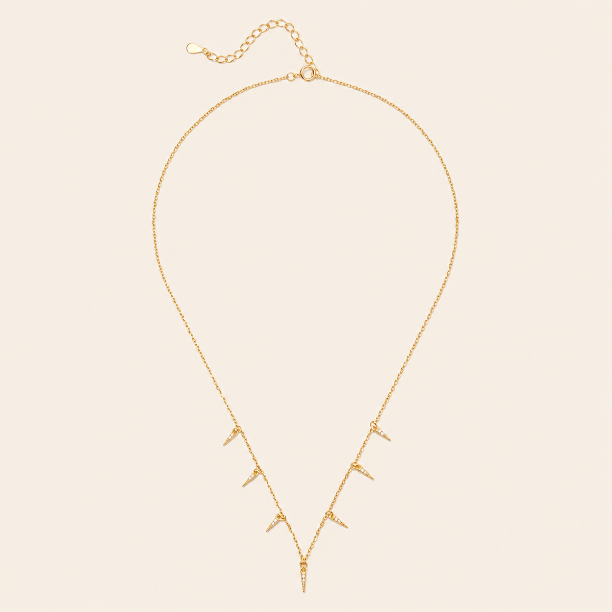 Fine Trace Necklace with a fine chain with small tapered drops in gold finish