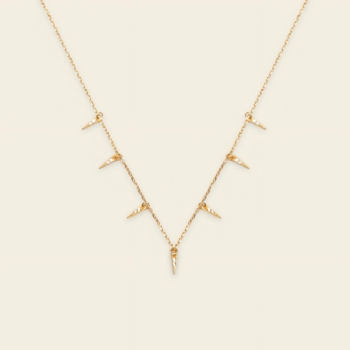 Fine Trace Necklace with a fine chain with small tapered drops in gold finish
